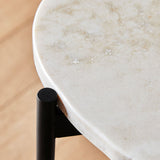 Ivory travertine top with black painted metal legs