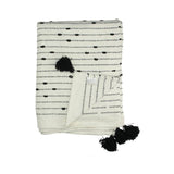 witte katoenen deken met pompons